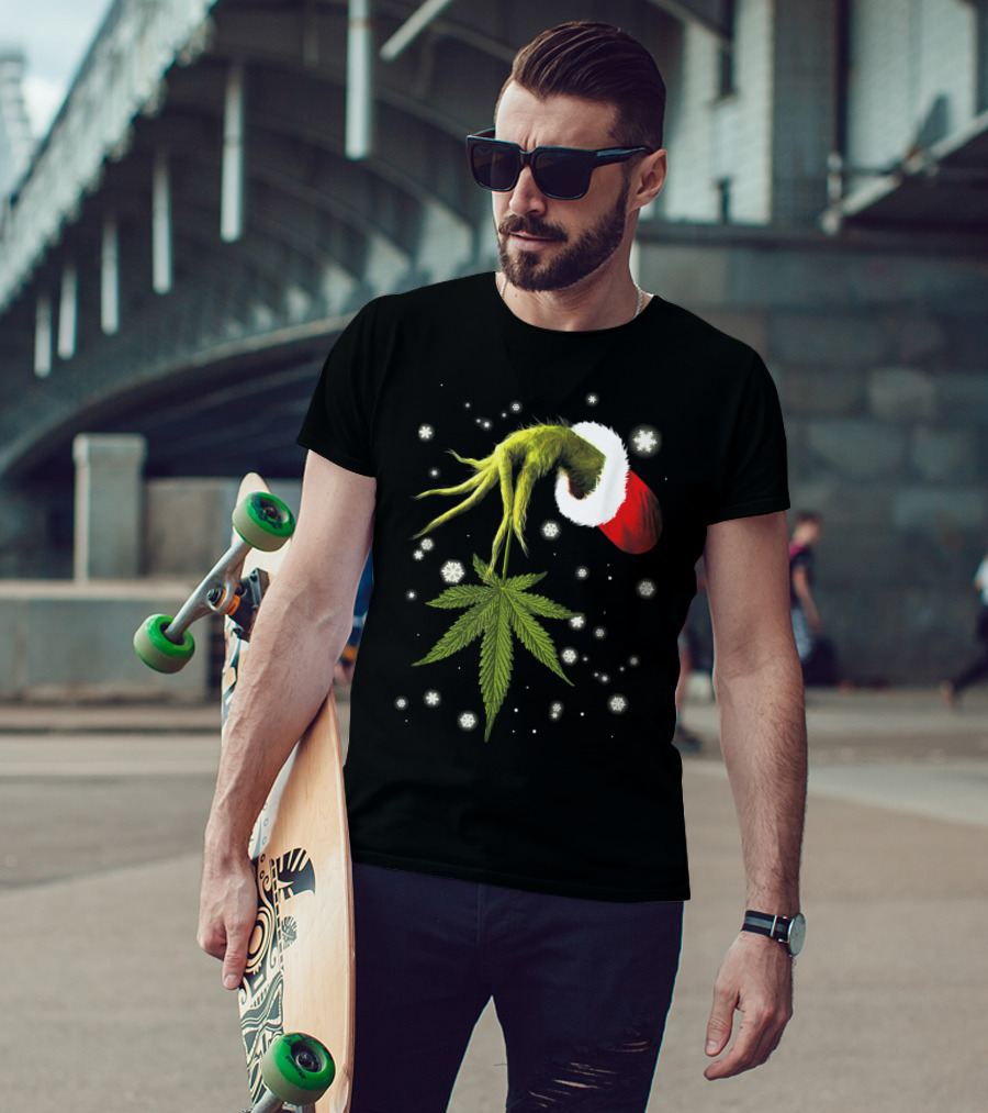 Grinch Hand Holding Cannabis Leaf With Santa Hat And Snowflakes T-Shirt