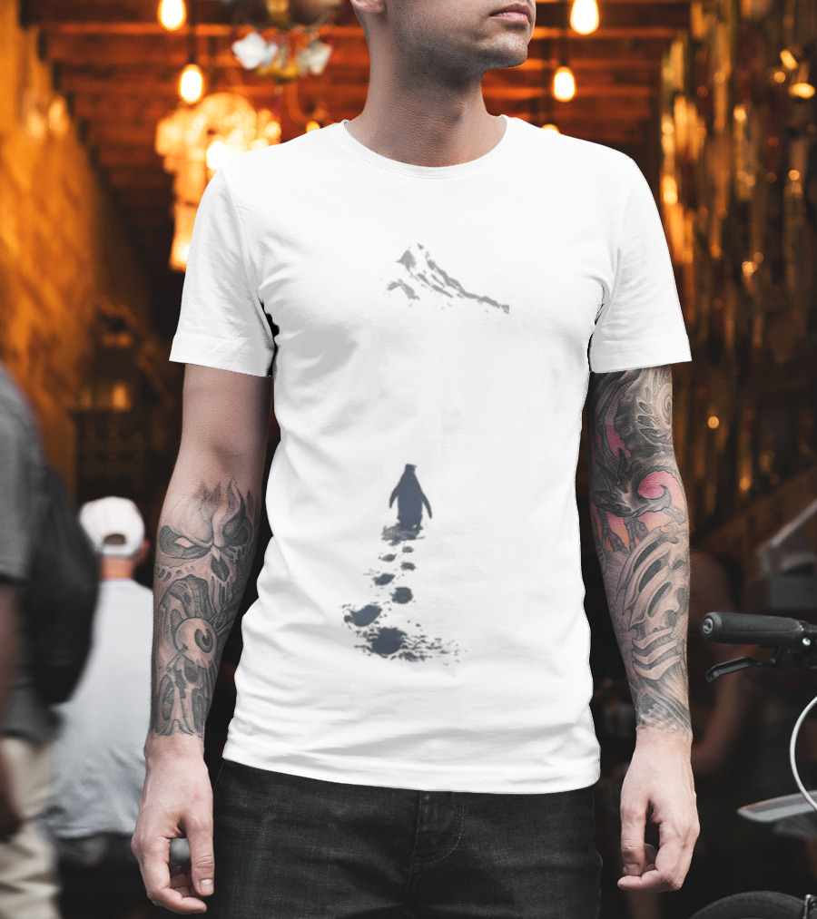 Nihilist Penguin Following Footprints Across White Snow T-Shirt