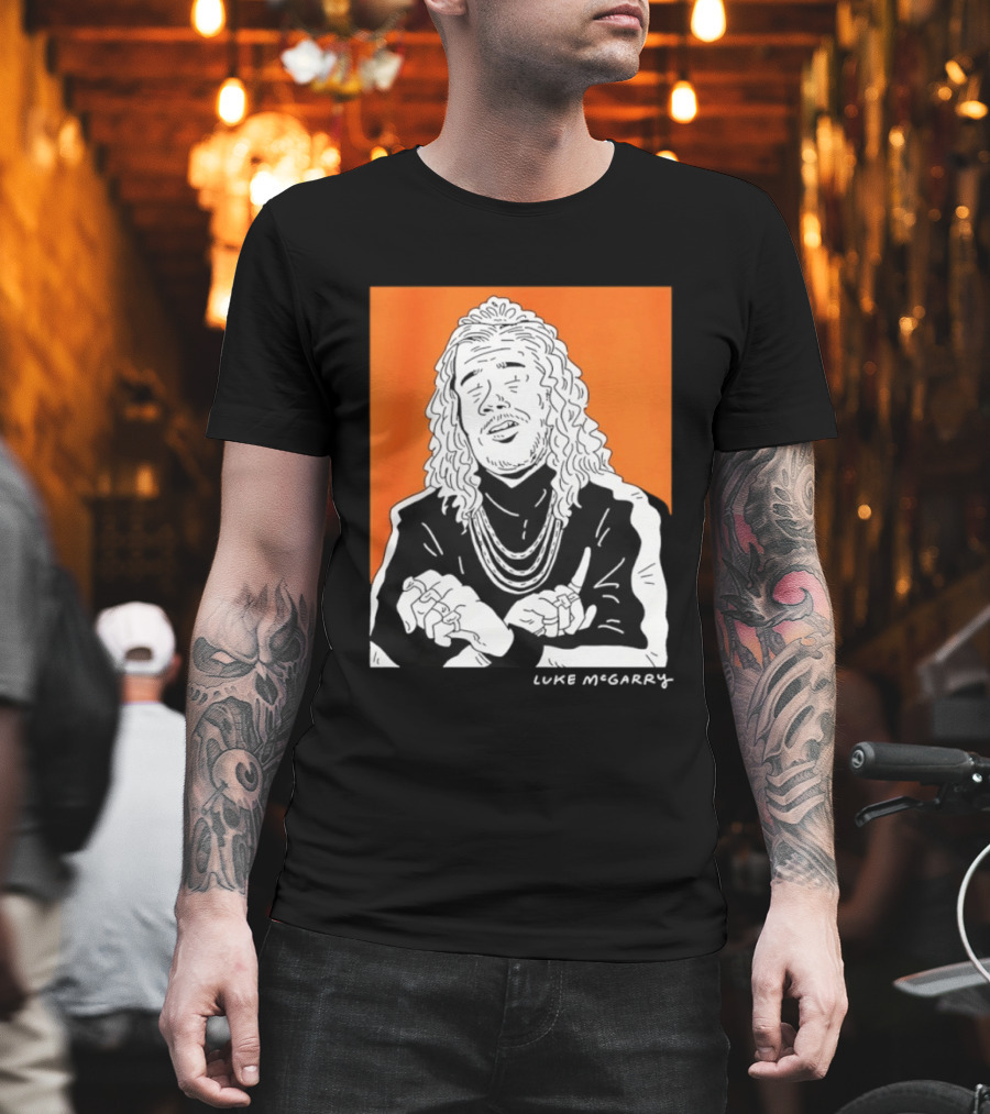 Luke McGarry Cartoon Character with Long Hair and Chains on Orange T-Shirt