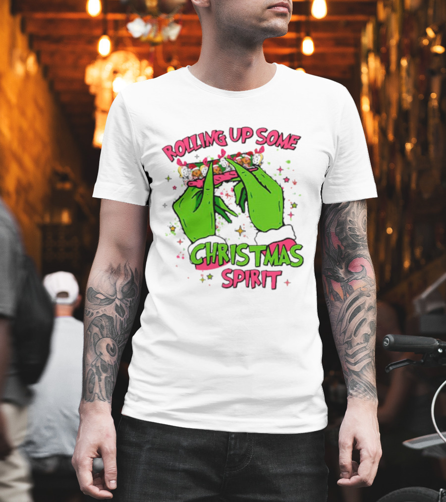 Grinch Rolling Up Some Christmas Spirit with Green Hands and Glitter Stars T-Shirt