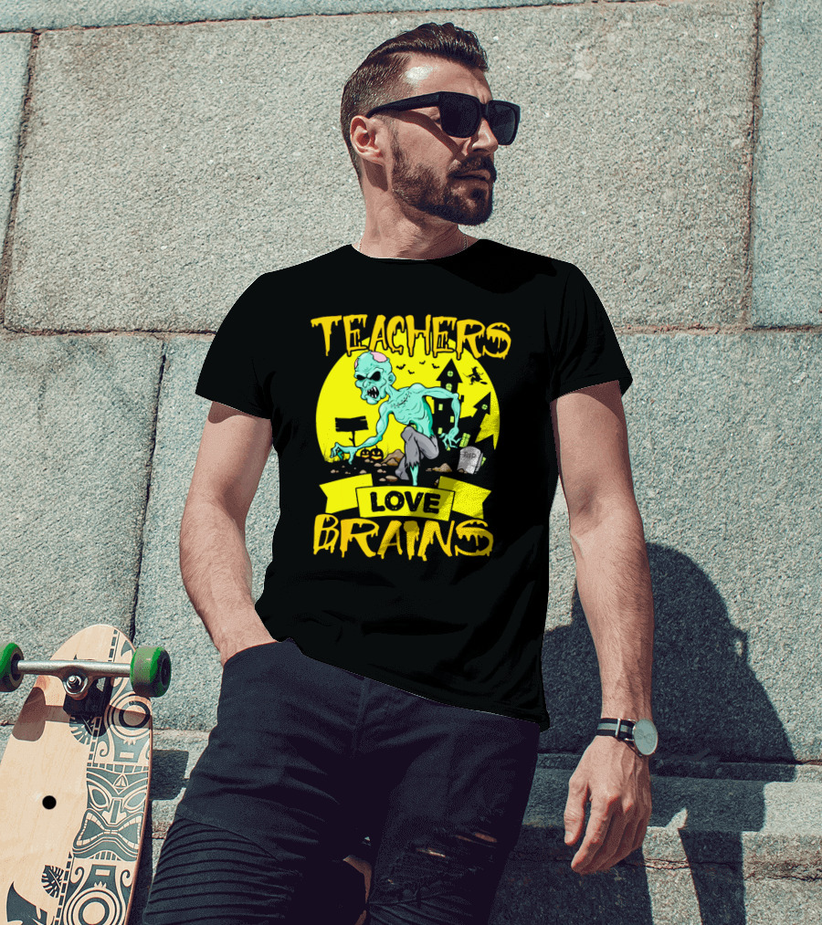 Teachers Love Brains Zombie Halloween Theme With Haunted Houses And Graveyard Background T-Shirt