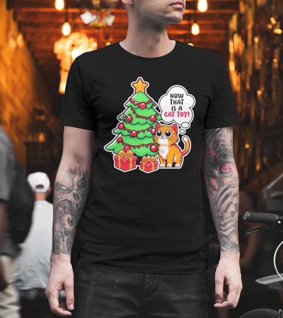 Now That Is A Cat Toy A Cute Orange Cat With Wide Eyes Next To Decorated Christmas Tree T-Shirt