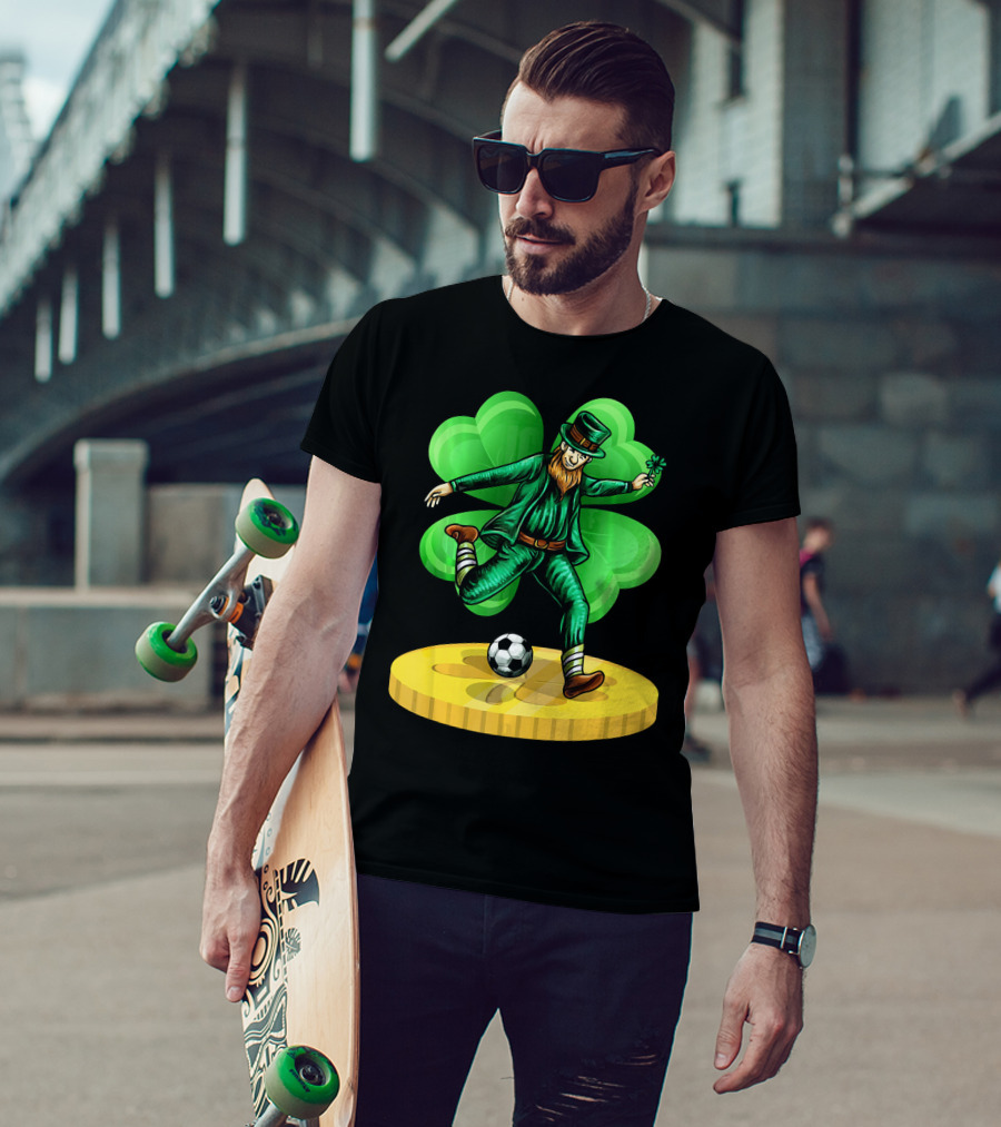 Leprechaun Kicking Soccer Ball On Gold Coin With Shamrock Background T-Shirt