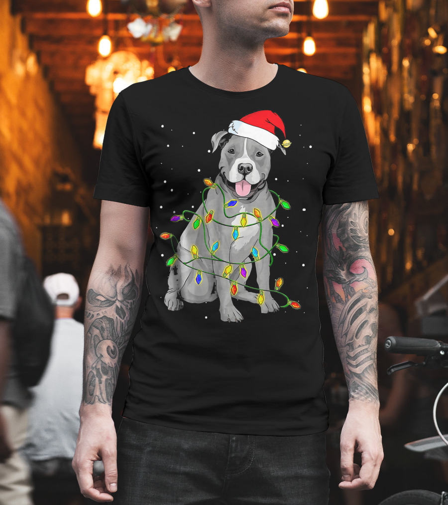 Pitbull in Santa Hat Wrapped in Christmas Lights with Snowy Background T-Shirt